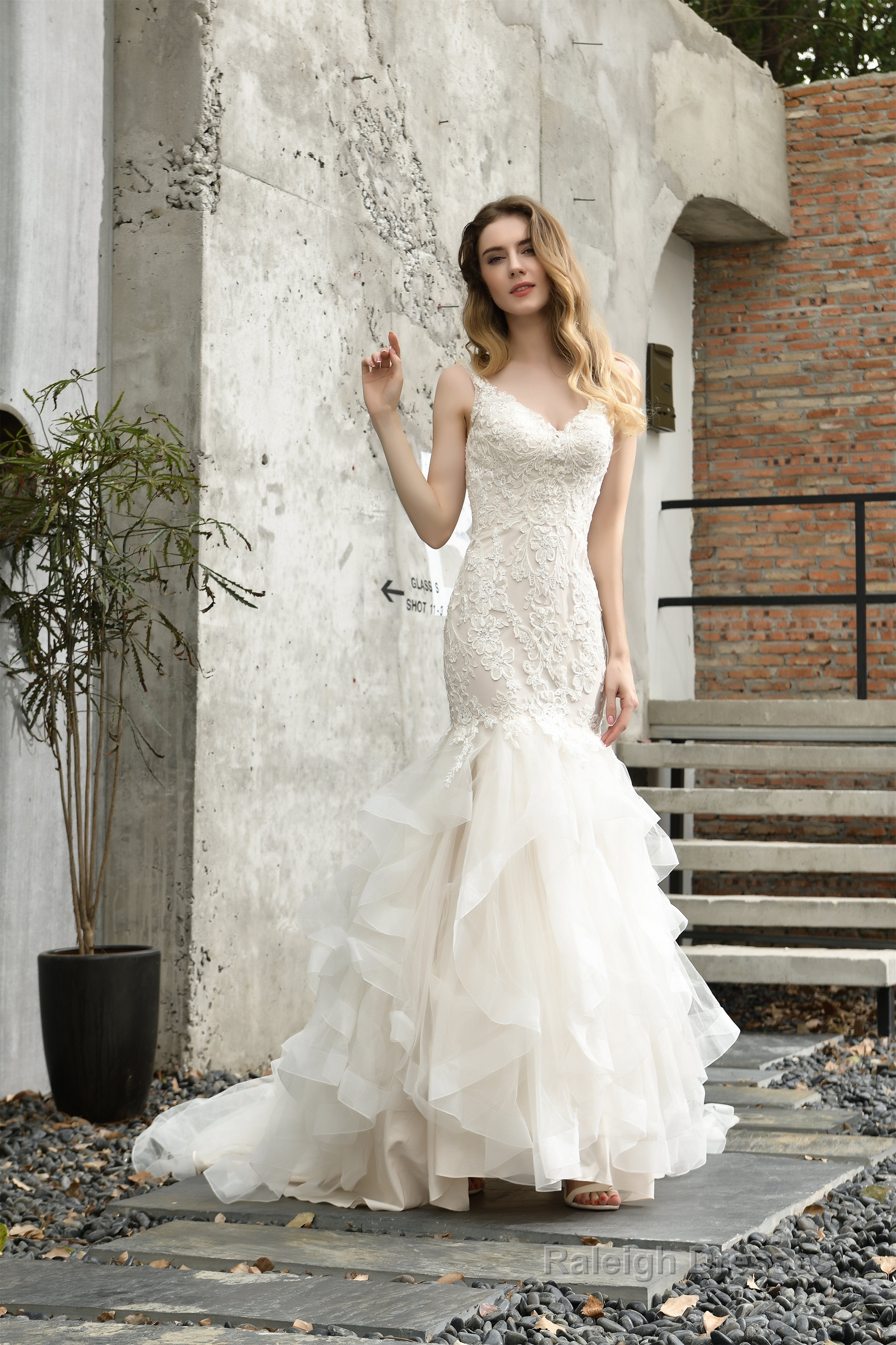 Ivory Mermaid Tulle Lace Appliques V-neck Wedding Dresses with Cascading Ruffles Main image