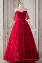 The Red Strapless Tulle Long A Line Prom Dress is a showstopper. With its off-the-shoulder design and A Line silhouette, it perfectly blends elegance and allure.